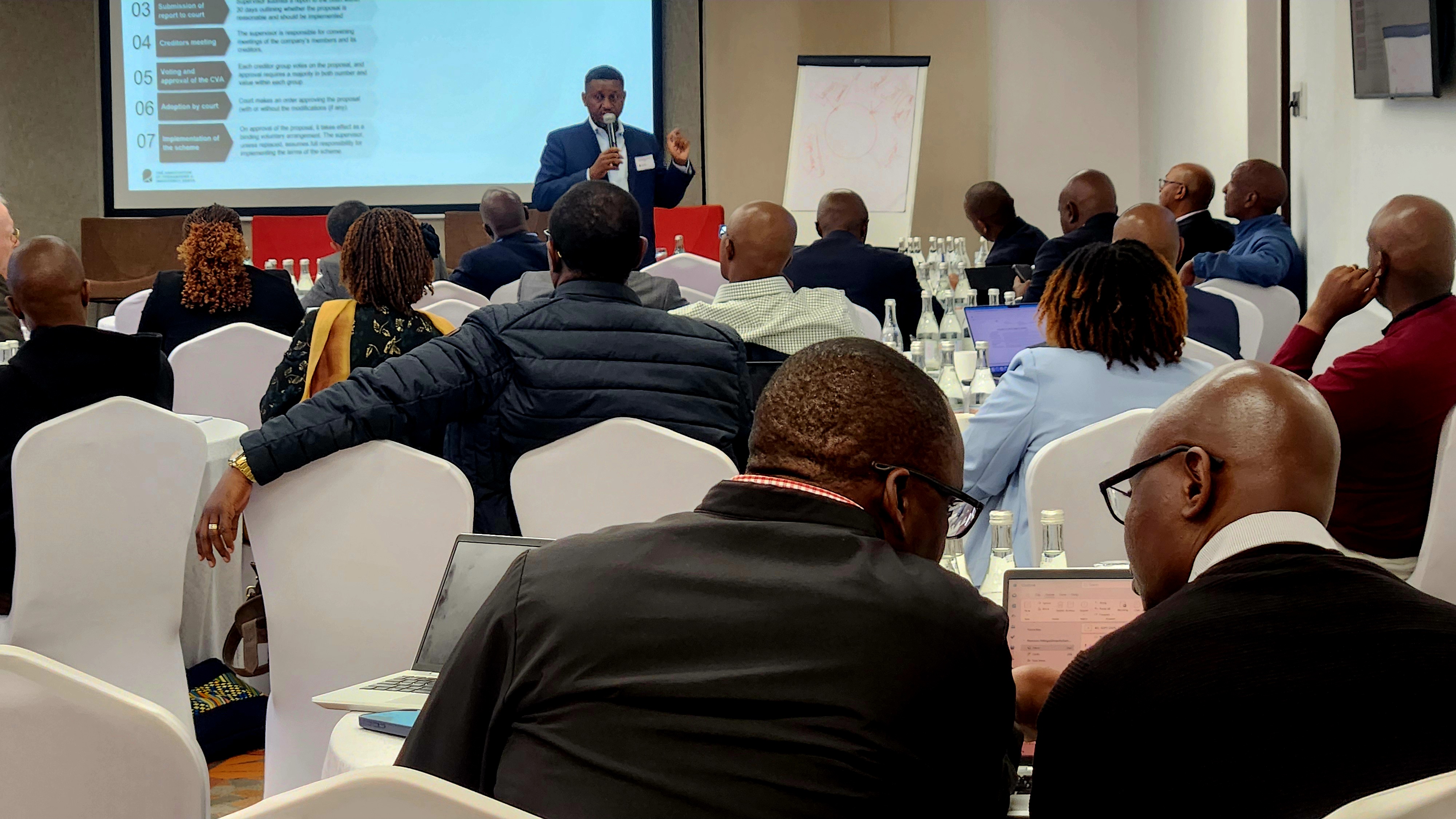 ATIK workshop presenter addressing insolvency professionals